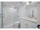Bright bathroom with a glass-enclosed shower, white subway tile and a marble-topped vanity with ample storage at 6372 Palma Del Mar S Blvd # 601, St Petersburg, FL 33715