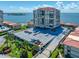Exterior shot featuring manicured grounds, parking, and multi-story building at 6372 Palma Del Mar S Blvd # 601, St Petersburg, FL 33715