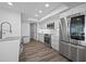 Chic kitchen featuring stainless steel appliances and bright white cabinetry at 6372 Palma Del Mar S Blvd # 601, St Petersburg, FL 33715