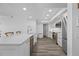 Modern kitchen with wood look flooring and white countertops, cabinetry, and backsplash at 6372 Palma Del Mar S Blvd # 601, St Petersburg, FL 33715