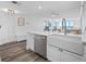 Chic kitchen with bar seating opening to the living space with ocean views at 6372 Palma Del Mar S Blvd # 601, St Petersburg, FL 33715