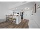 Modern kitchen with stainless steel appliances, a breakfast bar, and wood look flooring at 6372 Palma Del Mar S Blvd # 601, St Petersburg, FL 33715