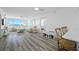Bright living room with modern décor and a large window showcasing ocean views at 6372 Palma Del Mar S Blvd # 601, St Petersburg, FL 33715