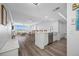 Bright, open floor plan with hardwood floors connecting the kitchen to the expansive living room at 6372 Palma Del Mar S Blvd # 601, St Petersburg, FL 33715