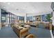 Beautiful community lounge with couches, chairs, tables, and access to windows in a well-lit common area at 6372 Palma Del Mar S Blvd # 601, St Petersburg, FL 33715