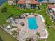 Birds eye view of a community pool area that includes umbrellas, lounge chairs, and a hot tub at 6372 Palma Del Mar S Blvd # 601, St Petersburg, FL 33715