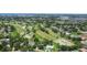 Beautiful aerial view of property near a golf course and residential homes in a peaceful neighborhood at 6921 8Th Street E Ct, Sarasota, FL 34243