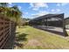 Expansive backyard with screened-in pool area, providing a private and serene outdoor retreat at 6921 8Th Street E Ct, Sarasota, FL 34243