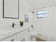 Well-lit bathroom featuring modern fixtures, a shower-tub combo, and a single sink vanity at 6921 8Th Street E Ct, Sarasota, FL 34243