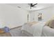 Bedroom featuring an area rug, a ceiling fan, and a view of the pool at 6921 8Th Street E Ct, Sarasota, FL 34243
