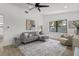 Inviting living room with a comfortable sectional sofa and a neutral color palette at 6921 8Th Street E Ct, Sarasota, FL 34243