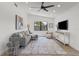 Cozy living room with vaulted ceilings, a sectional sofa, and bright decor at 6921 8Th Street E Ct, Sarasota, FL 34243