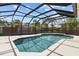 A stunning screened-in pool with a clean design and ample space for relaxing and entertaining outdoors at 6921 8Th Street E Ct, Sarasota, FL 34243