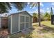 Convenient backyard storage shed, offering ample space for gardening tools and outdoor equipment at 6921 8Th Street E Ct, Sarasota, FL 34243