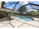 Relax and unwind in the screened-in pool area, a private oasis for leisure and recreation at 6921 8Th Street E Ct, Sarasota, FL 34243