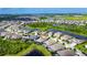 Aerial view of a charming neighborhood boasting serene lakes, lush landscaping, and a tranquil living environment at 7420 Paradiso Dr, Apollo Beach, FL 33572