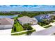 Aerial view of a community featuring homes with well-manicured lawns, with easy access to neighborhood streets at 7420 Paradiso Dr, Apollo Beach, FL 33572