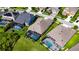 Aerial view of homes featuring screened-in pools, well-manicured lawns, and close proximity to neighborhood streets at 7420 Paradiso Dr, Apollo Beach, FL 33572