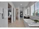 Bathroom with soaking tub, walk-in closet, and vanity at 7420 Paradiso Dr, Apollo Beach, FL 33572