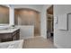 Spacious bathroom with glass-enclosed shower and walk-in closet entrance at 7420 Paradiso Dr, Apollo Beach, FL 33572