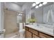 Bright bathroom featuring a glass-enclosed shower, sleek vanity, and modern fixtures at 7420 Paradiso Dr, Apollo Beach, FL 33572