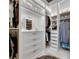 Organized walk-in closet with custom shelving, drawers, and ample storage space at 7420 Paradiso Dr, Apollo Beach, FL 33572