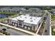 Modern fitness center with ample parking, landscaping, and an abundance of storefront windows at 7420 Paradiso Dr, Apollo Beach, FL 33572