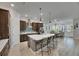 Bright kitchen with an oversized island, stainless appliances, and modern pendant lighting at 7420 Paradiso Dr, Apollo Beach, FL 33572