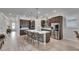 Modern kitchen with a large island, stainless steel appliances, and ample counter space for food preparation at 7420 Paradiso Dr, Apollo Beach, FL 33572