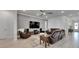 Inviting living room with stylish wall paneling, comfortable seating, and a view of the entryway at 7420 Paradiso Dr, Apollo Beach, FL 33572