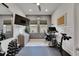 Well-equipped home office and workout area with modern decor and exercise equipment at 7420 Paradiso Dr, Apollo Beach, FL 33572