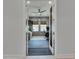 Open doorway to a stylish office featuring a ceiling fan and lots of natural light at 7420 Paradiso Dr, Apollo Beach, FL 33572