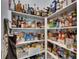 Walk-in pantry with shelving stocked with food and beverage items at 7420 Paradiso Dr, Apollo Beach, FL 33572