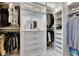 Well-lit walk-in closet with custom shelving and drawers at 7420 Paradiso Dr, Apollo Beach, FL 33572