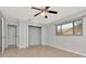 Bedroom with tile flooring, large closet, and natural light through window at 8626 Woodbridge Dr, New Port Richey, FL 34655
