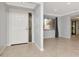 The foyer leads into the living room and has views of the living room, with tile flooring at 8626 Woodbridge Dr, New Port Richey, FL 34655