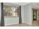 The room has new blinds and paint, with tile floors throughout at 8626 Woodbridge Dr, New Port Richey, FL 34655