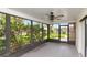 The screened in porch is a great place to enjoy the outdoors in comfort at 8626 Woodbridge Dr, New Port Richey, FL 34655