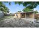 The home's backyard features a patio and is surrounded by wooden and vinyl fencing at 8804 Lido Ln, Port Richey, FL 34668