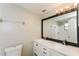 Updated bathroom featuring a double sink vanity, large mirror, and modern fixtures at 8804 Lido Ln, Port Richey, FL 34668