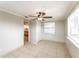 Neutral bedroom with ceiling fan and tile flooring at 8804 Lido Ln, Port Richey, FL 34668