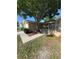 Charming single-story home with mature landscaping and a cozy front entrance at 8804 Lido Ln, Port Richey, FL 34668