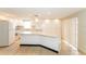 Bright kitchen featuring ample storage space and a large island at 8804 Lido Ln, Port Richey, FL 34668