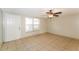Cozy living area featuring neutral paint, tile floors, and natural light at 8804 Lido Ln, Port Richey, FL 34668
