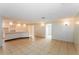 Large living room featuring tile floors with access to the kitchen and other areas of the house at 8804 Lido Ln, Port Richey, FL 34668