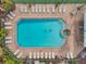 Overhead view of a pool and whirlpool tub with lounge chairs for relaxation in the community at 899 Addison Ne Dr, St Petersburg, FL 33716