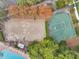 Overhead view of a community sand volleyball court and basketball court at 899 Addison Ne Dr, St Petersburg, FL 33716