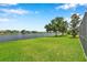 Backyard lawn with beautiful lake views at 899 Addison Ne Dr, St Petersburg, FL 33716