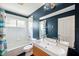 Clean bathroom featuring a bath and vanity with dual sinks at 899 Addison Ne Dr, St Petersburg, FL 33716
