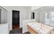 This large bathroom features a walk-in shower, soaking tub and dual sinks at 899 Addison Ne Dr, St Petersburg, FL 33716
